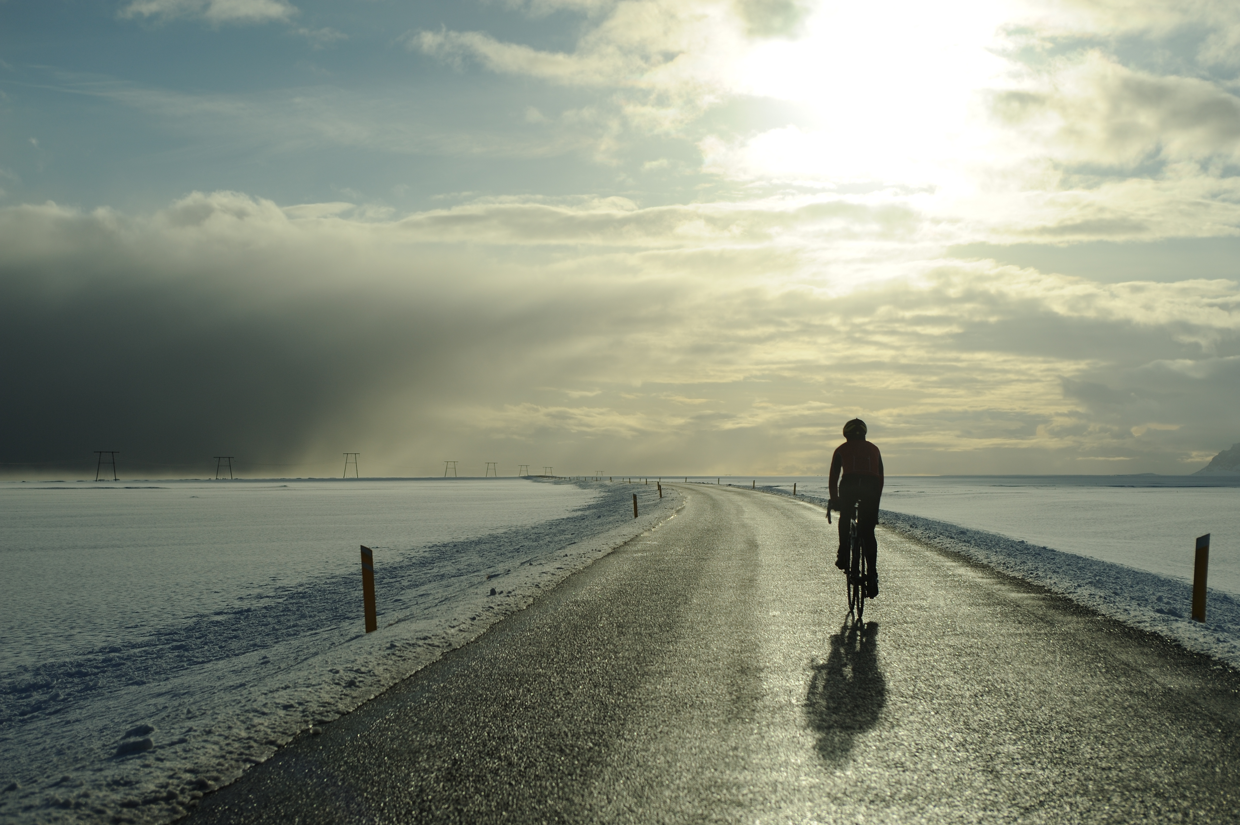 Omar biking around Iceland followed by a rental car from Go Iceland Car Rental