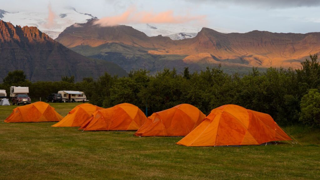 Orange tents set up at the Skaftafell camping ground in South Iceland.