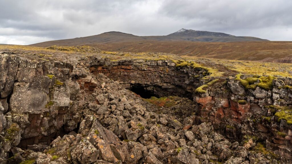 The rocky exterior of the Víðgelmir Lava Cave. 