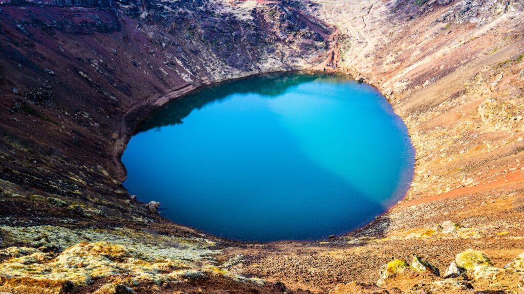 Bright blue water in the Kerid crater near Reykjavík.