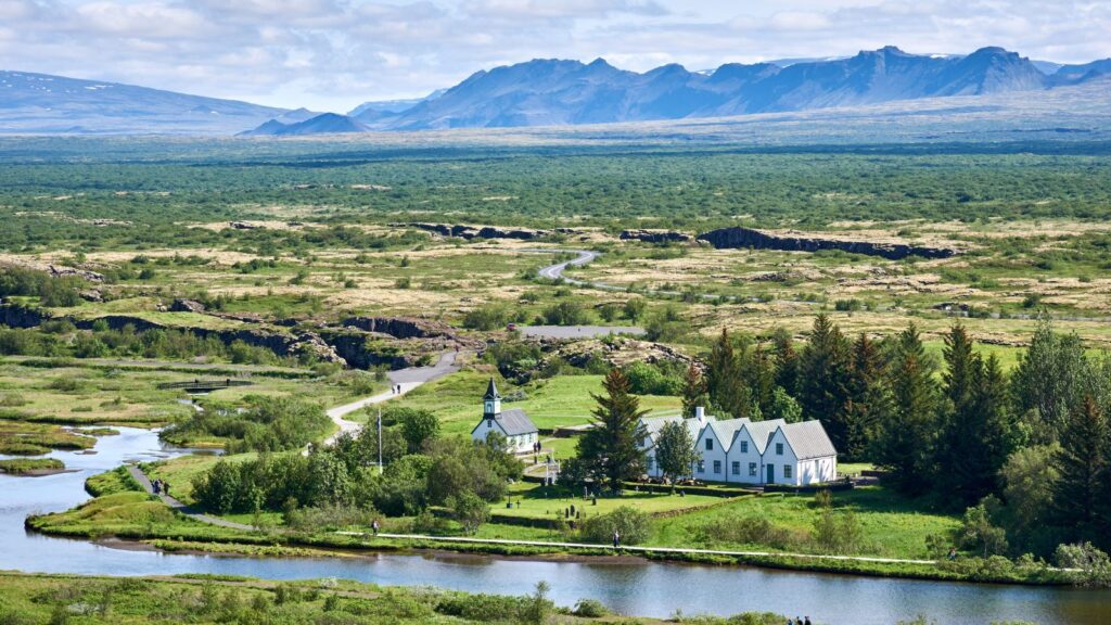 Aerial view of the Thingvellir National Park showing the Þingvellir Church and Þingvellir House on the Oxara River. 